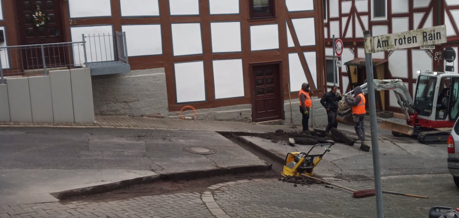 Straße Asphaltarbeiten Bauarbeiter Straßenschild 